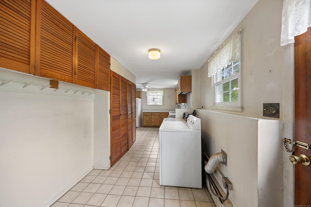 1519 Tuttle Ave, Wallingford, CT 06492 - washroom featuring cabinet space, independent washer and dryer, a ceiling fan, and light tile patterned flooring