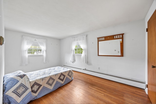 1519 Tuttle Ave, Wallingford, CT 06492 - bedroom with a baseboard radiator, multiple windows, and wood finished floors