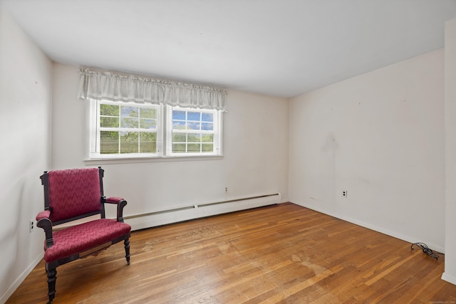 1519 Tuttle Ave, Wallingford, CT 06492 - unfurnished room featuring a baseboard radiator and wood finished floors