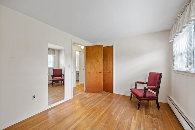 1519 Tuttle Ave, Wallingford, CT 06492 - sitting room featuring baseboard heating and light wood finished floors