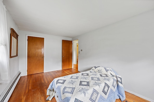 1519 Tuttle Ave, Wallingford, CT 06492 - bedroom with a baseboard radiator and wood finished floors