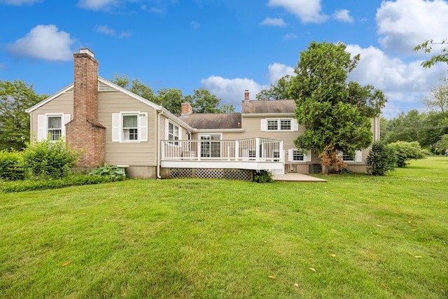 1519 Tuttle Ave, Wallingford, CT 06492 - rear view of property featuring a chimney, a wooden deck, and a lawn