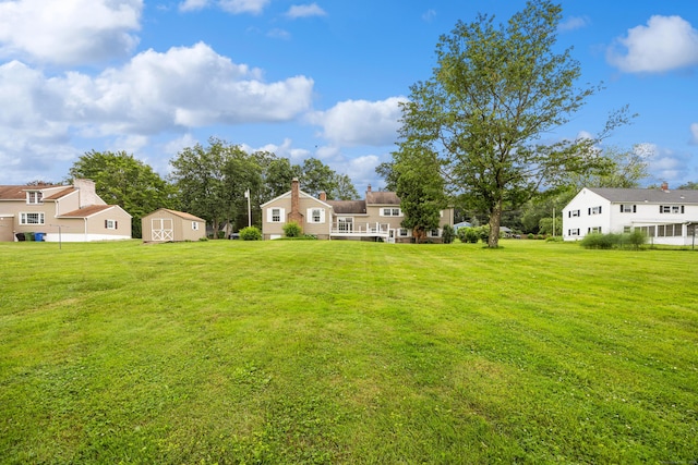 1519 Tuttle Ave, Wallingford, CT 06492 - view of green lawn with a storage unit and a residential view