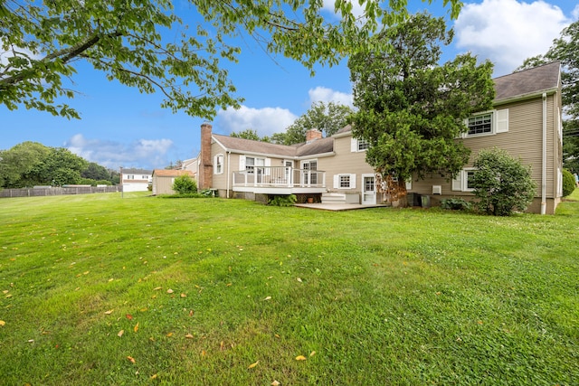 1519 Tuttle Ave, Wallingford, CT 06492 - back of property with a wooden deck and a chimney