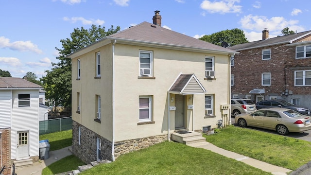 6 Houghton St, Bristol, CT 06010 - view of front of property with stucco siding, cooling unit, and a chimney