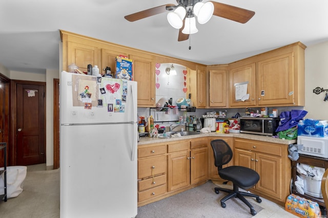 6 Houghton St, Bristol, CT 06010 - kitchen with freestanding refrigerator, light countertops, stainless steel microwave, and a ceiling fan