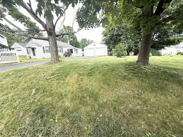 103 Starkweather St, Manchester, CT 06042 - view of grassy yard featuring a garage, an outbuilding, and a residential view