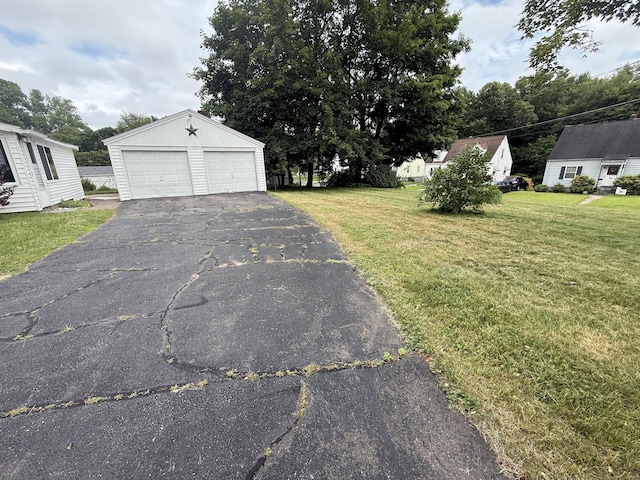 103 Starkweather St, Manchester, CT 06042 - view of green lawn with an outdoor structure and a garage