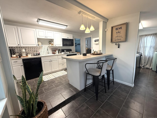 103 Starkweather St, Manchester, CT 06042 - kitchen with black appliances, a peninsula, tasteful backsplash, white cabinets, and a kitchen breakfast bar