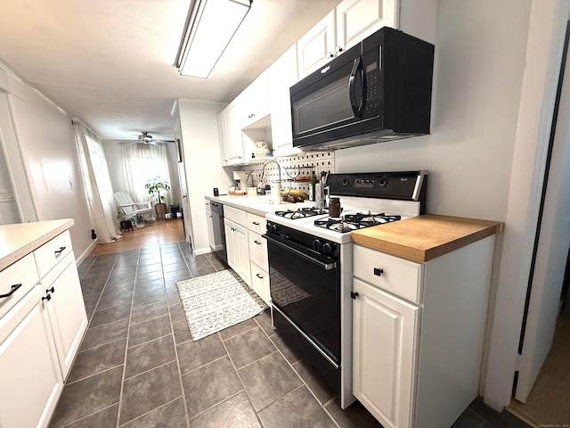 103 Starkweather St, Manchester, CT 06042 - kitchen with range with gas stovetop, black microwave, dishwashing machine, and white cabinetry