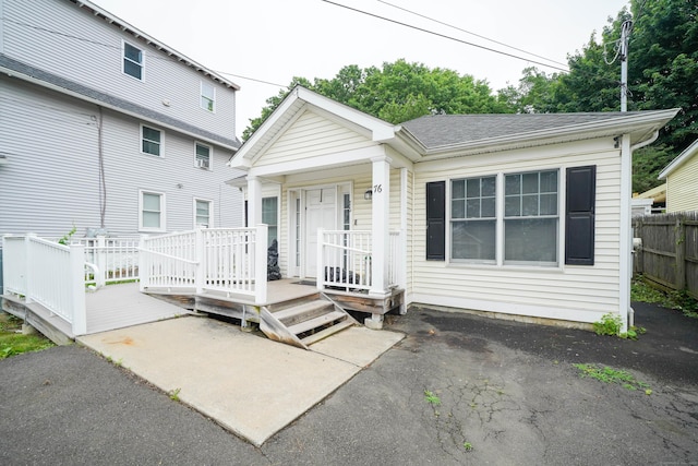 76 White St, Bridgeport, CT 06610 - view of front of house featuring covered porch and a shingled roof
