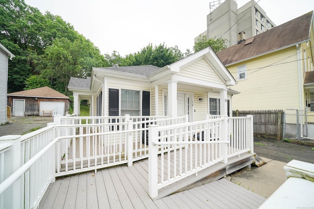 76 White St, Bridgeport, CT 06610 - wooden terrace featuring an outbuilding and a garage