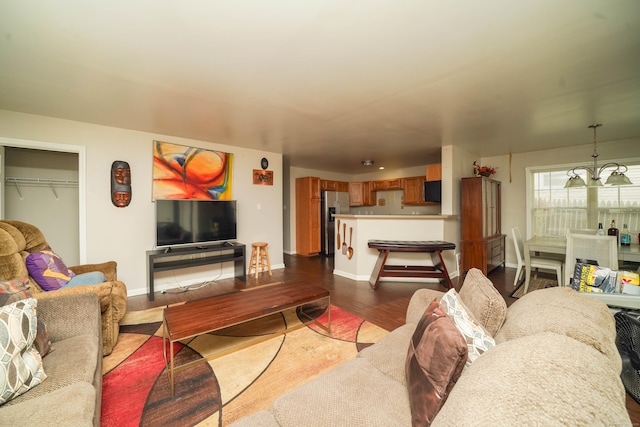 76 White St, Bridgeport, CT 06610 - living area with dark wood-style floors and a chandelier
