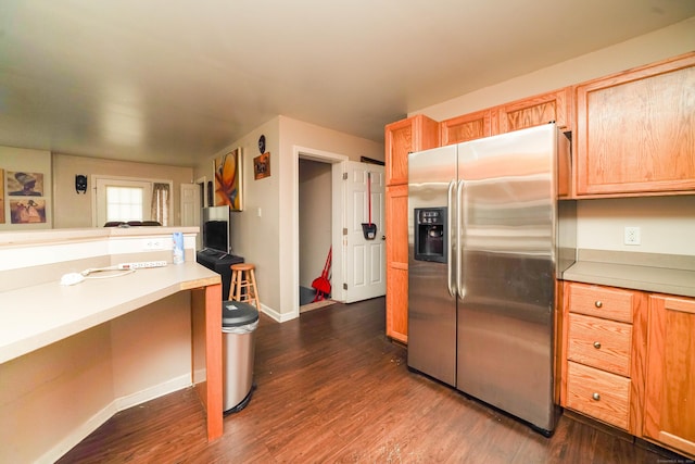 76 White St, Bridgeport, CT 06610 - kitchen with stainless steel fridge with ice dispenser, dark wood finished floors, and light countertops