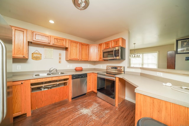 76 White St, Bridgeport, CT 06610 - kitchen featuring stainless steel appliances, a peninsula, dark wood finished floors, light countertops, and recessed lighting
