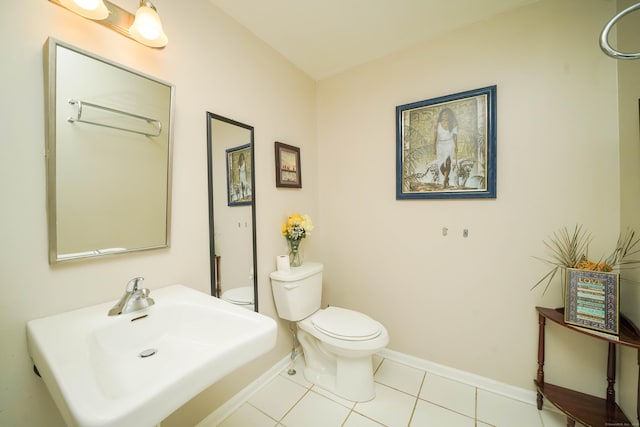 76 White St, Bridgeport, CT 06610 - bathroom featuring a sink and tile patterned floors