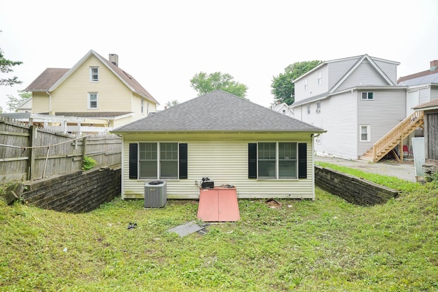 76 White St, Bridgeport, CT 06610 - back of house with a shingled roof and stairway