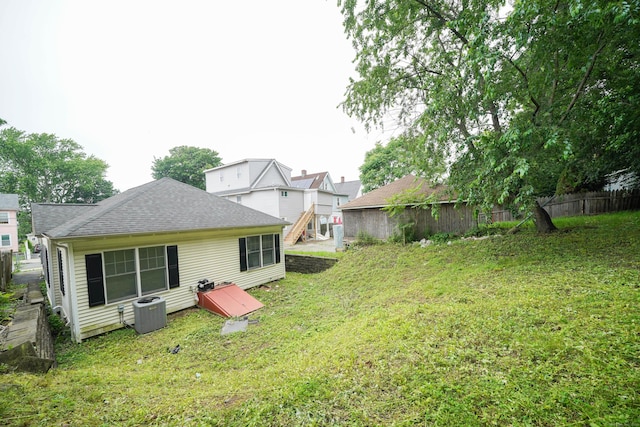 76 White St, Bridgeport, CT 06610 - rear view of property with roof with shingles