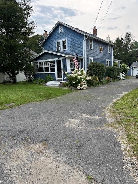 58 Barlow St, North Canaan, CT 06018 - rear view of house with a chimney, a lawn, and asphalt driveway