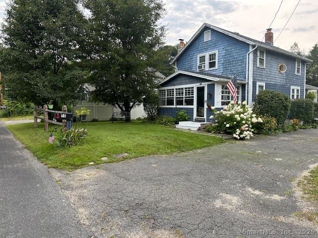 58 Barlow St, North Canaan, CT 06018 - view of front facade featuring a chimney and a front lawn