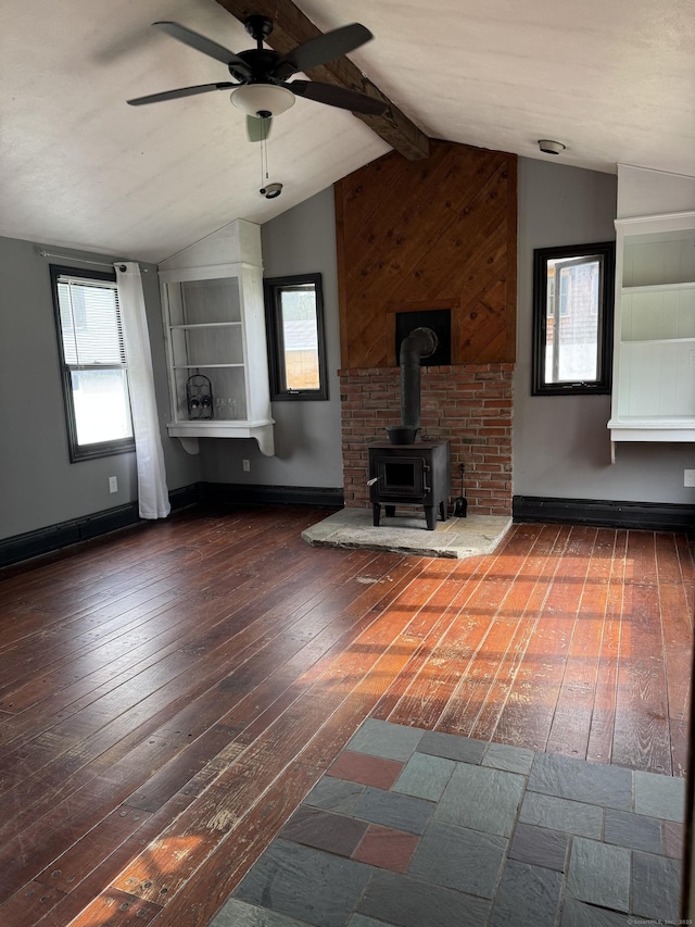 58 Barlow St, North Canaan, CT 06018 - unfurnished living room featuring ceiling fan, hardwood / wood-style flooring, and a wood stove