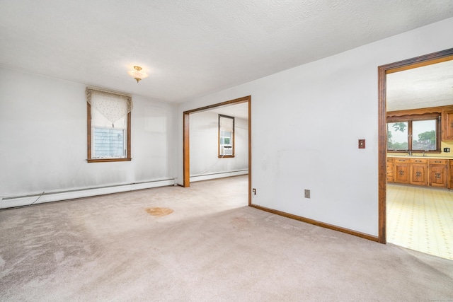 546 S Quaker Ln, West Hartford, CT 06110 - unfurnished room with a baseboard radiator and light carpet