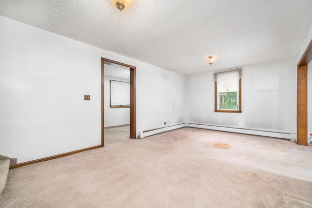 546 S Quaker Ln, West Hartford, CT 06110 - carpeted spare room featuring a textured ceiling and a baseboard radiator