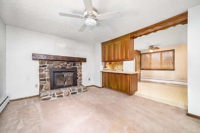 546 S Quaker Ln, West Hartford, CT 06110 - unfurnished living room featuring a baseboard heating unit, light colored carpet, ceiling fan, and a textured ceiling