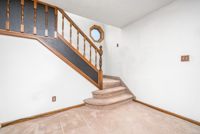 546 S Quaker Ln, West Hartford, CT 06110 - staircase with carpet flooring and a textured ceiling