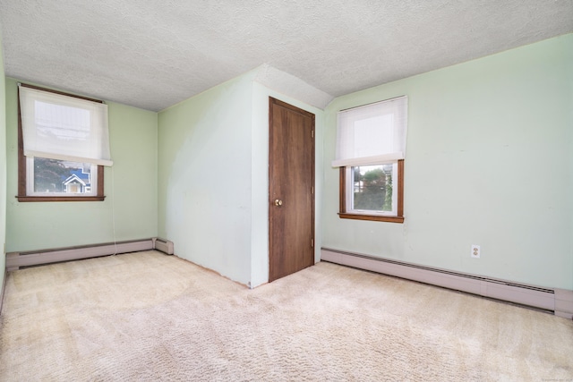 546 S Quaker Ln, West Hartford, CT 06110 - unfurnished bedroom with a baseboard heating unit, carpet flooring, a textured ceiling, and a closet