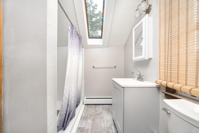 546 S Quaker Ln, West Hartford, CT 06110 - full bath with a baseboard heating unit, vanity, wood finished floors, and a shower with curtain