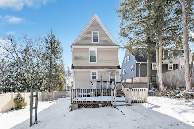 18 Morningside Ave, Waterbury, CT 06708 - snow covered back of property with a fenced backyard and a wooden deck