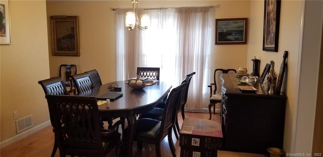 27 Amber Pl, Waterbury, CT 06705 - dining room with wood finished floors and a chandelier