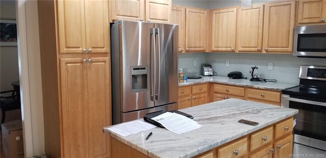 27 Amber Pl, Waterbury, CT 06705 - kitchen with appliances with stainless steel finishes, light brown cabinetry, tasteful backsplash, and light stone countertops