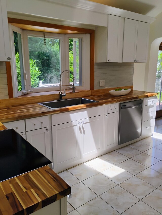 3 Rye Ridge Parkway, West Hartford, CT 06117 - kitchen with butcher block countertops, dishwasher, arched walkways, decorative backsplash, and light tile patterned floors