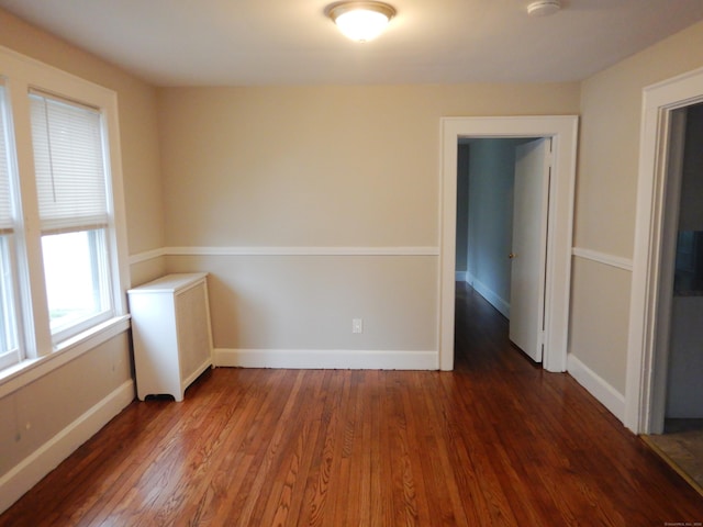11 Morton St, New London, CT 06320 - unfurnished room featuring wood finished floors, radiator heating unit, and a smoke detector