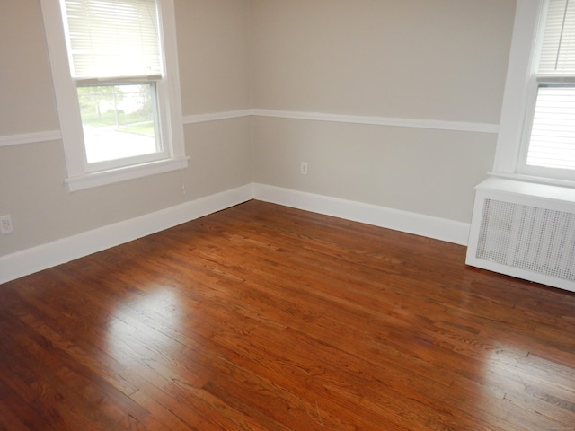 11 Morton St, New London, CT 06320 - spare room featuring radiator heating unit and wood finished floors