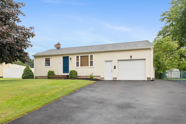 301 Pondview Dr, Southington, CT 06489 - view of front of home with a chimney, a garage, and driveway
