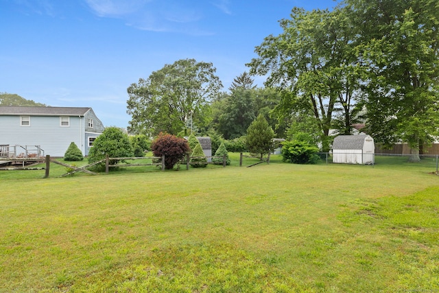 301 Pondview Dr, Southington, CT 06489 - fenced backyard featuring a storage unit