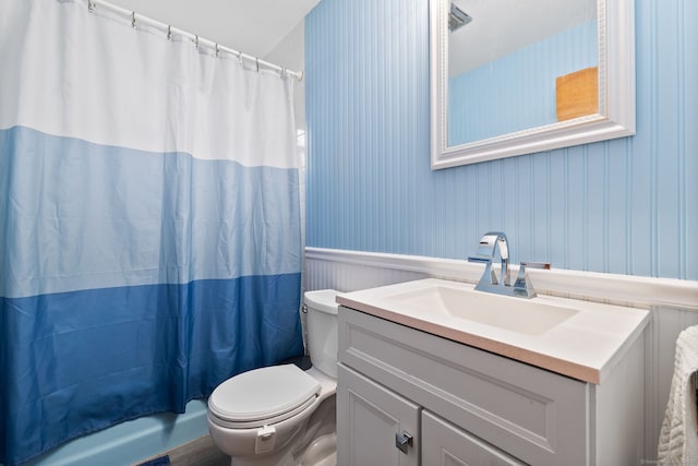 301 Pondview Dr, Southington, CT 06489 - full bathroom featuring vanity, a wainscoted wall, and shower / bath combo