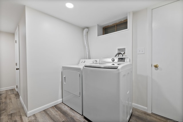 301 Pondview Dr, Southington, CT 06489 - laundry area featuring separate washer and dryer, wood finished floors, and recessed lighting