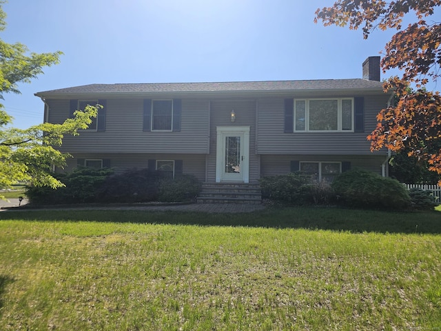 142 Raffia Rd, Enfield, CT 06082 - raised ranch with entry steps, a front lawn, and a chimney