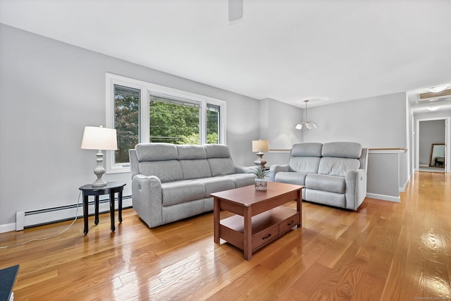 142 Raffia Rd, Enfield, CT 06082 - living room with baseboard heating and light wood-type flooring