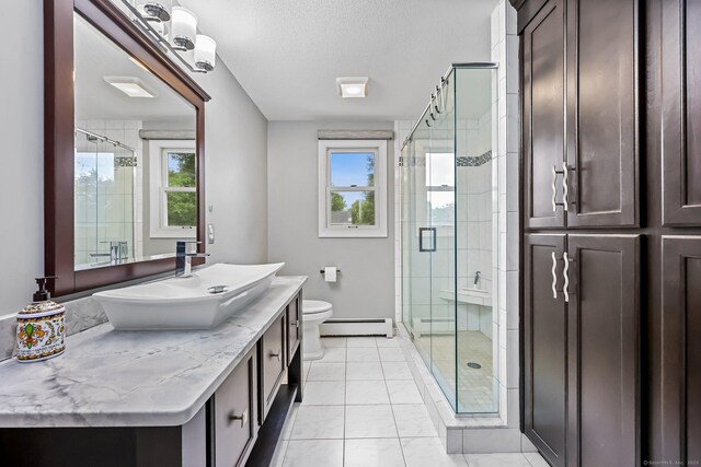 142 Raffia Rd, Enfield, CT 06082 - bathroom with a baseboard heating unit, plenty of natural light, vanity, a stall shower, and a textured ceiling