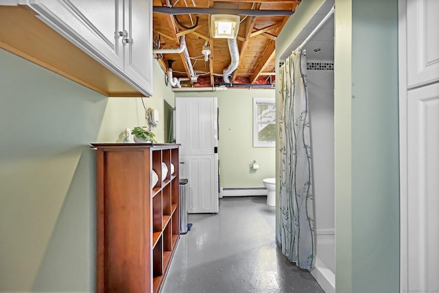 142 Raffia Rd, Enfield, CT 06082 - corridor featuring a baseboard heating unit and finished concrete flooring