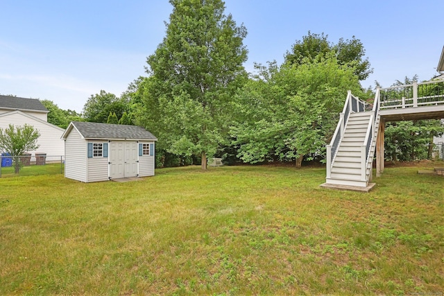 142 Raffia Rd, Enfield, CT 06082 - view of yard featuring stairs, a storage unit, and a deck