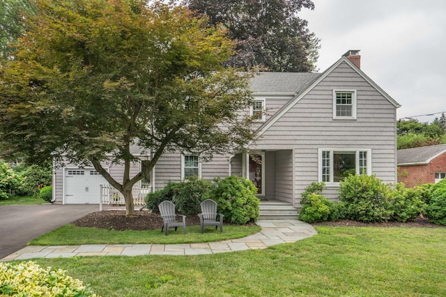 11 Craigmoor Rd, West Hartford, CT 06107 - view of front of property featuring a chimney, asphalt driveway, a front lawn, and a garage