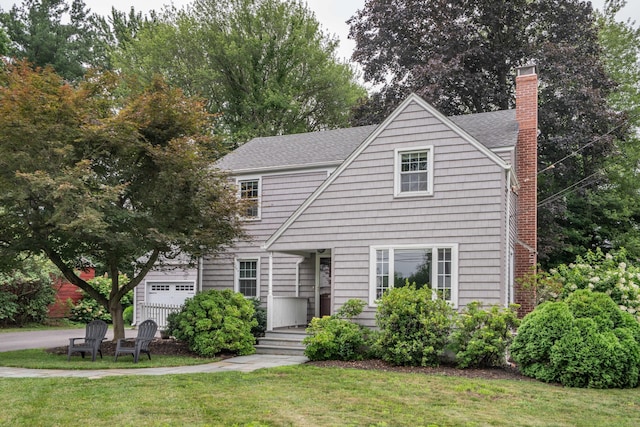 11 Craigmoor Rd, West Hartford, CT 06107 - view of front of home featuring a front yard, a chimney, and roof with shingles