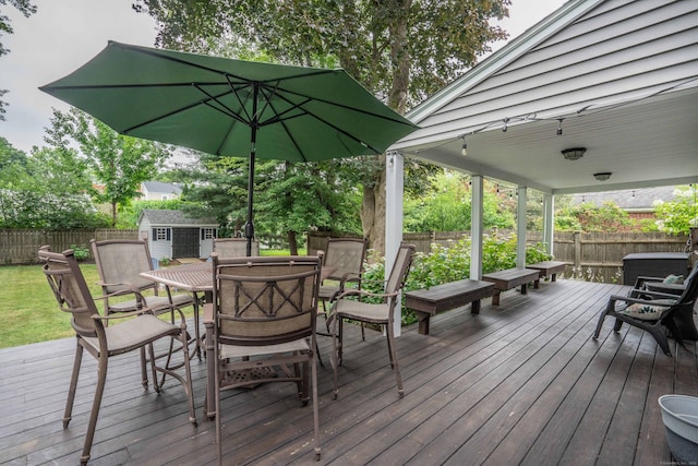 11 Craigmoor Rd, West Hartford, CT 06107 - wooden terrace with outdoor dining space, a storage shed, and a fenced backyard