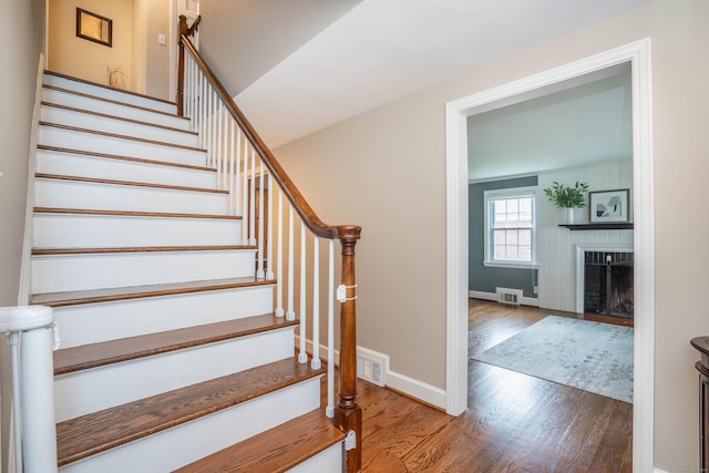 11 Craigmoor Rd, West Hartford, CT 06107 - stairs with wood finished floors and a fireplace